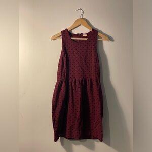 Maroon dress with polka dots.